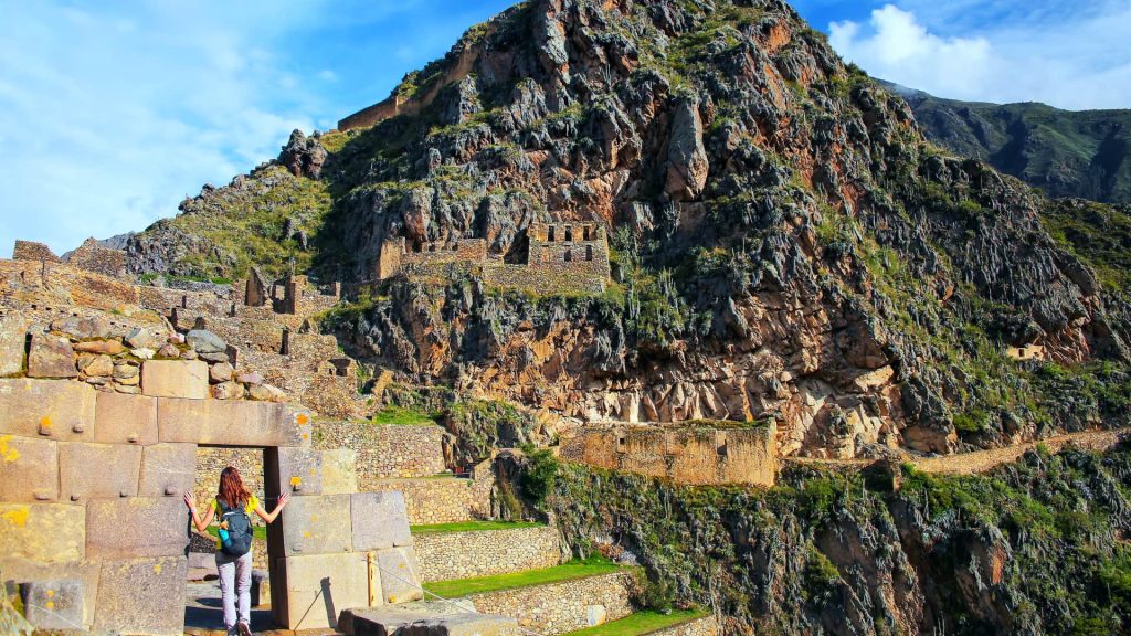 Tourists exploring the traditional market in Ollantaytambo.