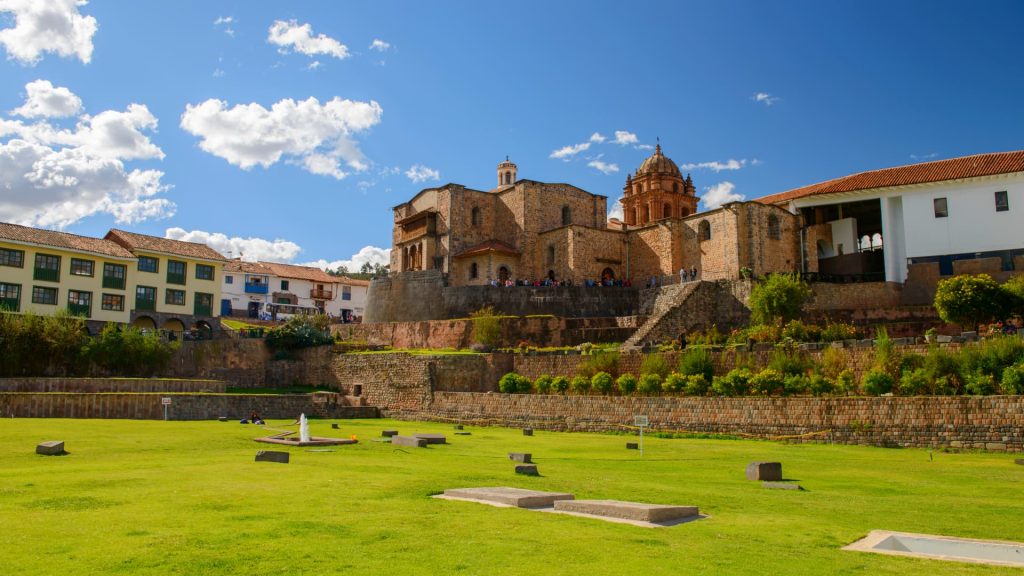 Qorikancha Temple of the Sun in Cusco, one of the most important Inca structures, featuring impressive architecture and lush green gardens. - Ali Peru Trek.