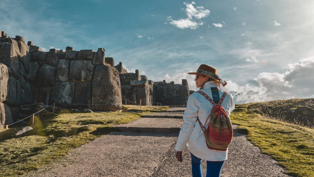 A view of the massive, perfectly fitted megalithic stone walls of the Sacsayhuaman fortress near Cusco, a testament to Inca architectural power. - Ali Peru Treks