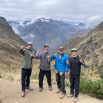 A group celebrating at the summit of Dead Woman’s Pass.