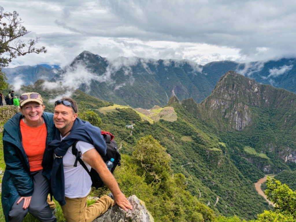 Happy couple posing during their scenic machu picchu hike