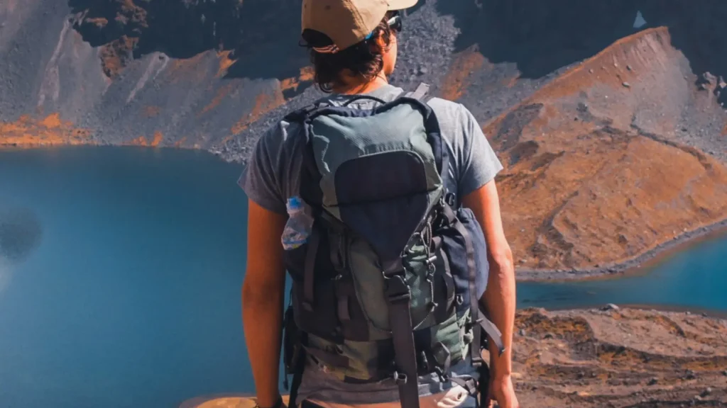 Hiker Admiring an Andean Lake