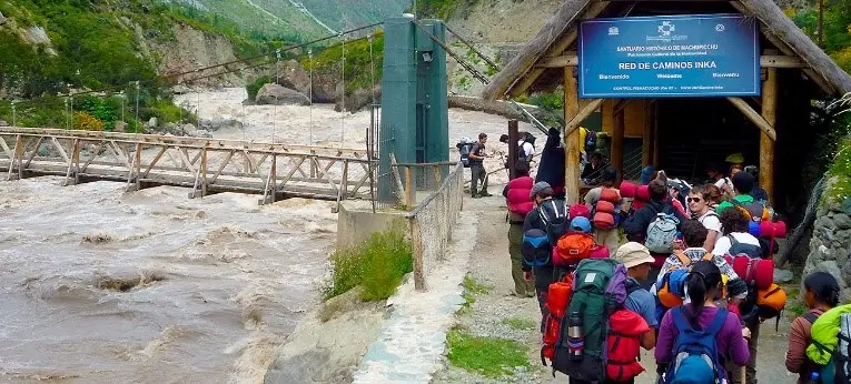 Travelers at the start of the Inca Trail heading toward the checkpoint