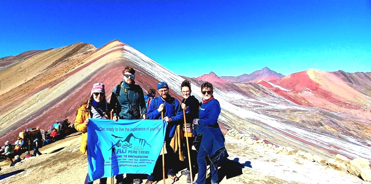 Hikers enjoying a less crowded Rainbow Mountain tour with a 6 AM departure from Cusco