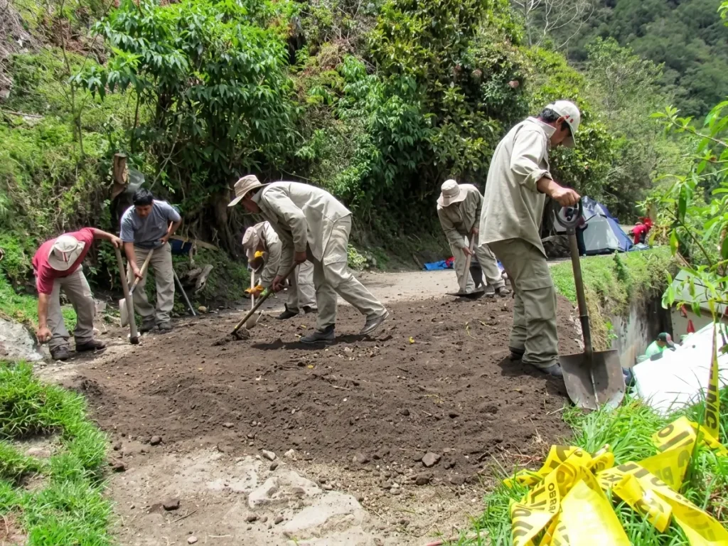 Staff performing maintenance and upkeep work on a trail in the Inca Trail Network at the Machu Picchu Historic Sanctuary