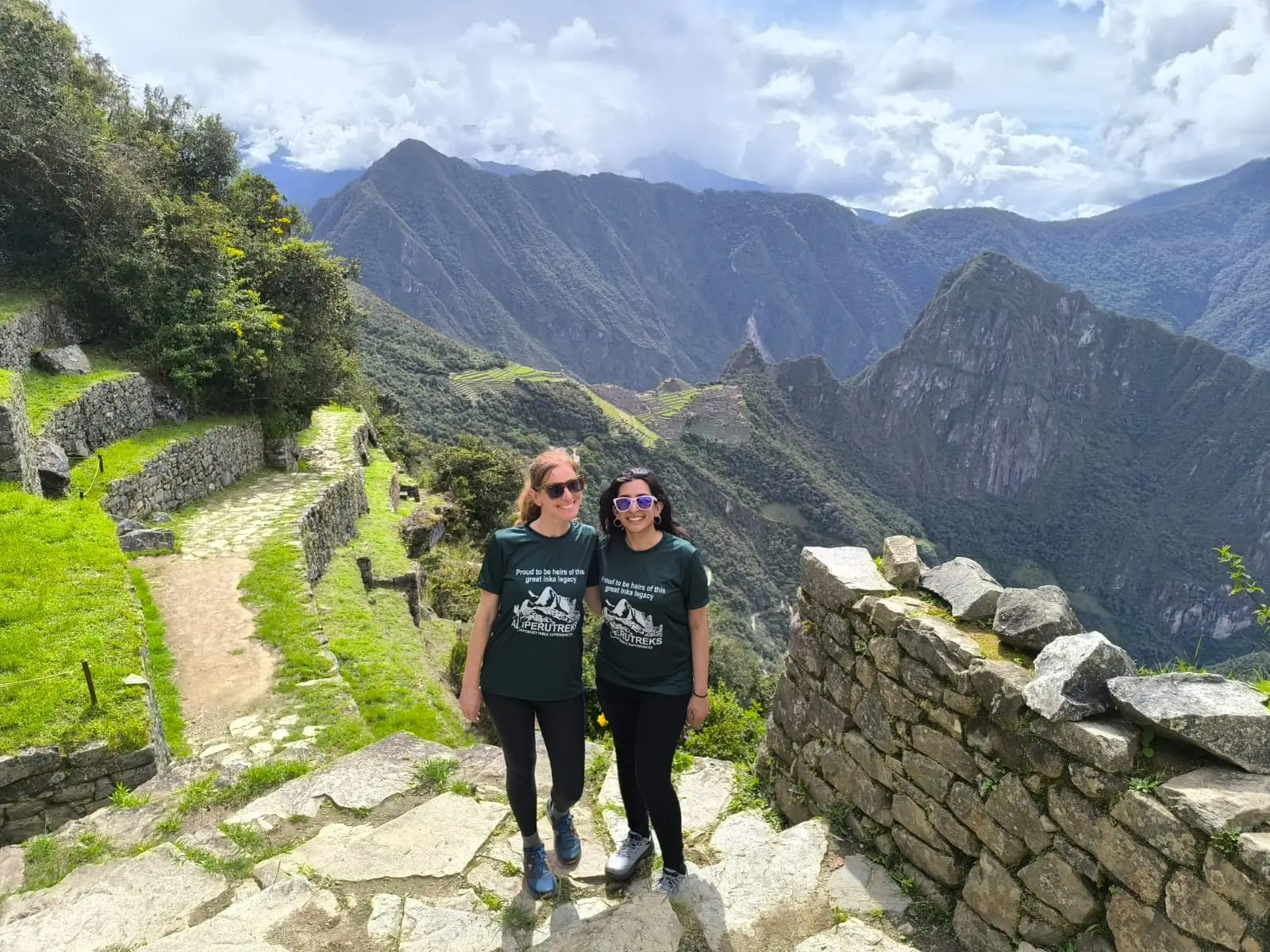 Two hikers smiling at the Sun Gate Machu Picchu after the 4-day trek