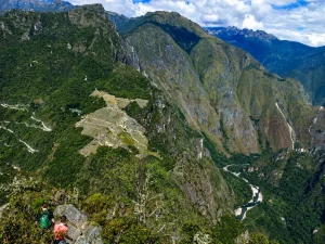 Panoramic view of Machu Picchu sanctuary showcasing the classic postcard perspective and the different access circuits for travelers.
